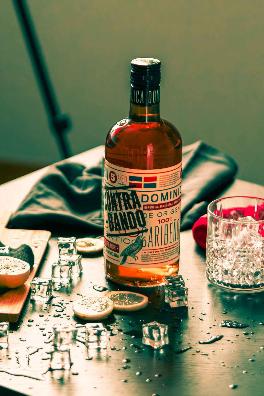 Bottle of dark rum on a wooden surface